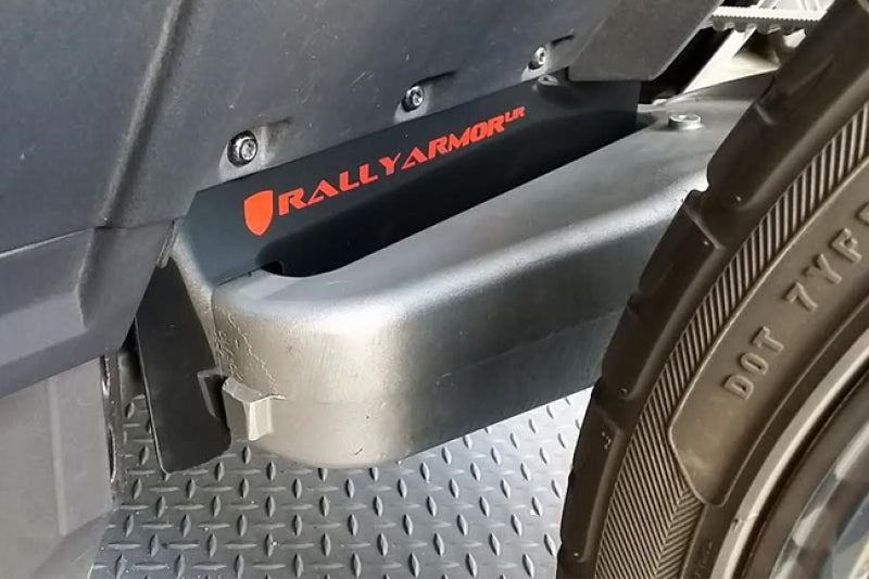 Rally Armor 15-24 Polaris Slingshot Rear Swingarm Black UR Mud Flap w/Orange Logo (MOQ 200 PCS)