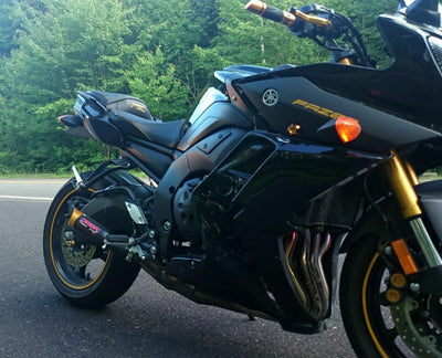 a black motorcycle parked on the side of the road