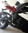 a white and black motorcycle parked in a garage