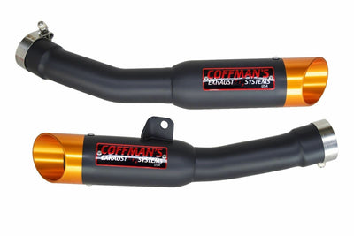 two black and orange exhaust pipes for a motorcycle